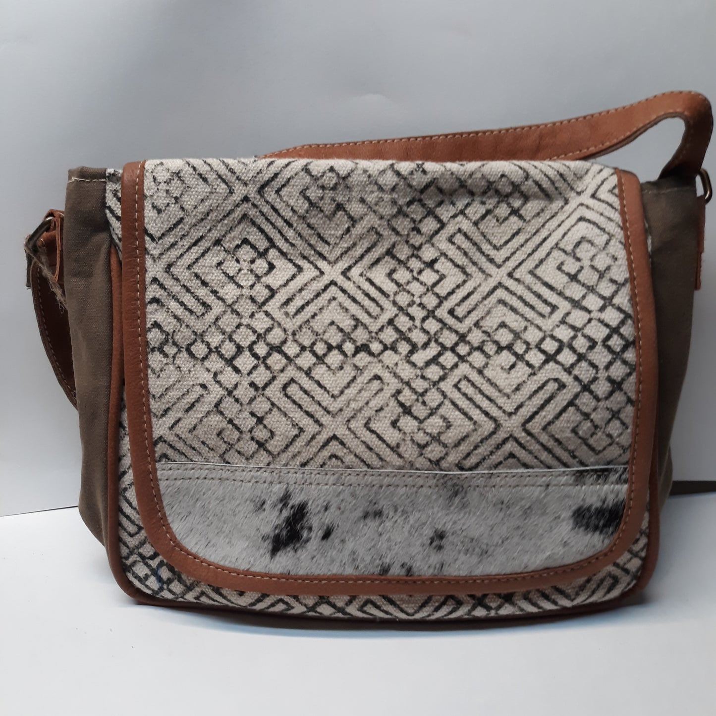 Cross Body Accented with Cow Hide